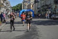 Lots of runners with sportswear and running shoes during the marathon Royalty Free Stock Photo