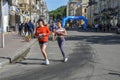 Lots of runners with sportswear and running shoes during the marathon Royalty Free Stock Photo