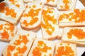 Delicious sandwiches with red salmon caviar. Royalty Free Stock Photo