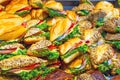 Lots of sandwiches in a display window of a diner cooking for sale