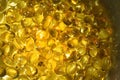 Lots of shine yellow capsules, golden oil fish omega 3 capsules. Omega oil pils. Fitness Fish oil