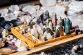 Lots of simple small multi colored decorative crystals on sale, group of objects detail closeup, shallow dof Large set of crystals