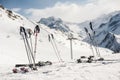 Lots of skis, poles and snowboards, stuck in the snow Royalty Free Stock Photo