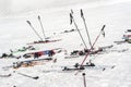 Lots of skis, poles and snowboards, stuck in the snow Royalty Free Stock Photo