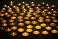 Lots of small burning candles on a dark background Royalty Free Stock Photo