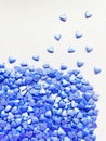 lots of small decorative candy blue hearts