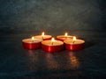 Lots of small lit candles. Dark mysterious atmosphere.Candle background. Royalty Free Stock Photo