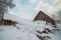 Lots of snow covered wooden houses