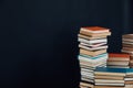 Lots of stacks of books on black background of university library Royalty Free Stock Photo