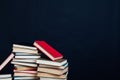 Lots of stacks of educational books to teach at the college library on a black background Royalty Free Stock Photo