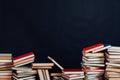 Lots of stacks of educational books to teach at the college library on a black background Royalty Free Stock Photo