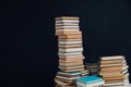 Lots of stacks of old educational books on black background library Royalty Free Stock Photo