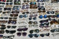 Lots of sunglasses and shades in a flea market in a sunny day in Istanbul