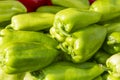 Lots of sweet green peppers on the counter in the market. Health, vitamins and organic products. Close-up Royalty Free Stock Photo