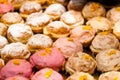 Lots of sweet tasty donuts without a hole, warm background texture pattern. Group of delicious traditional european doughnuts