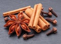 Lots of three spices for mulled wine and star anise, cinnamon and clove, macro Royalty Free Stock Photo