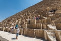 Lots of tourists climbing the Pyramid of Khufu in The Giza pyramid complex, an archaeological site on the Giza Plateau, on the