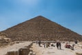 Lots of tourists climbing the Pyramid of Khufu in The Giza pyramid complex, an archaeological site on the Giza Plateau, on the