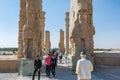 Lots tourists at the Ruins of the Gate of All Nations in the Persepolis in Shiraz, Iran. The ceremonial capital of the Achaemenid Royalty Free Stock Photo