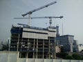 Jakarta/Indonesia July 16 2019 lots of tower construction site with cranes and building with blue sky background