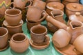 Lots of traditional ukrainian handmade clay pottery production. brown pottery. Clay plates and cups