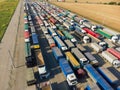 Lots of trucks with trailers in the parking lot. Queue for unloading at the port