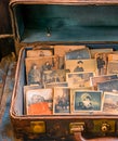 Lots of vintage photos in an old suitcase. Old photos Royalty Free Stock Photo