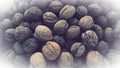 Lots of walnuts close up. Unpeeled walnuts with shells. A bunch of nuts. background. Vegetarian healthy diet