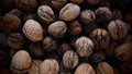 Lots of walnuts close up. Unpeeled walnuts with shells. A bunch of nuts. background. Vegetarian healthy diet