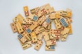 Lots of wooden dominos on white background with selective focus Royalty Free Stock Photo