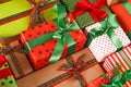 Lots of xmas gift boxes. Stylish modern presents in colored paper. Crop, close up Royalty Free Stock Photo