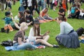 Lots of young girls and guys having fun during Hippie Day in park