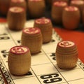 Lotto board game. Wooden lotto barrels and cards. Bingo game. Gambling