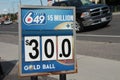 tor, canada - august 1, 2023: lotto 649 5 million dollars thirty dollars gold ball logo sign outside outdoors. p
