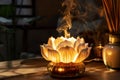 Lotus flower shaped aroma lamp diffusing scented smoke in a spa Royalty Free Stock Photo