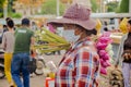 Lotus flowers vendor in a crowded market of Phnom Penh, Cambodia. August 30, 2015