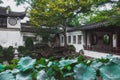 Lotus leaves and traditional Chinese architecture at Lingering Garden Scenic Area, Suzhou, Jiangsu, China Royalty Free Stock Photo