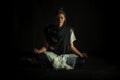 Lotus Pose on a black background Royalty Free Stock Photo