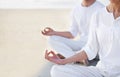 Lotus pose, couple and meditation on beach for zen and wellness with holistic healing outdoor for calm and yoga. Ocean