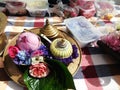 Lotus rose and rosette in a tray on hand-woven fabric