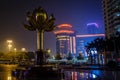 Lotus square with bronze flower the independence symbol of Macau and neon lights of surrounding buildings, China Royalty Free Stock Photo