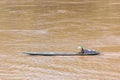 LOUANGPHABANG, LAOS - JANUARY 11, 2017: Boat offshore Nam Khan river. Copy space for text.