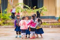 LOUANGPHABANG, LAOS - JANUARY 11, 2017: Children in the school yard. Copy space for text. Close-up. Royalty Free Stock Photo