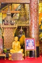 LOUANGPHABANG, LAOS - JANUARY 11, 2017: Golden statue of a Buddhist monk. Copy space for text. Vertical. Royalty Free Stock Photo