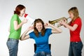 Loud friends bothering girl Royalty Free Stock Photo
