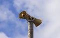 A loudspeaker horn on a pole Royalty Free Stock Photo