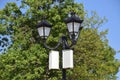 The loudspeaker on the pole. Outdoor speakers for fun walking in the park. A pillar with lights and speakers. Royalty Free Stock Photo