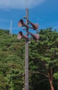 Loudspeakers broadcast tower with a blue sky and Mountain background .