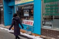 A Louer For Rent in French signs behind store windows during Covid-19 pandemic