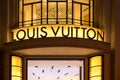 Louis Vuitton, illuminated jewelry and high couture brand name on Champs Elysees avenue in Paris